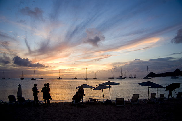summer vacation; people on beach at dusk